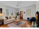Cozy living room with hardwood floors, natural light, and comfortable seating at 1801 Wilmore Dr, Charlotte, NC 28203