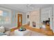 Comfortable living room with stone fireplace and beautiful hardwood floors at 1801 Wilmore Dr, Charlotte, NC 28203