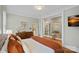 Spacious bedroom with hardwood floors and a connecting door to another room at 1801 Wilmore Dr, Charlotte, NC 28203