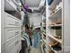 Walk-in closet featuring custom shelving, drawers, and ample storage space at 1801 Wilmore Dr, Charlotte, NC 28203