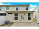 Rear exterior view showcasing the vinyl siding and a concrete patio at 1828 Aston Mill Pl, Charlotte, NC 28273