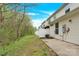 Backyard view with a concrete patio, green space, and white privacy fence at 1828 Aston Mill Pl, Charlotte, NC 28273