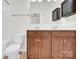 Bathroom featuring double sinks, vanity with storage, a toilet, and a shower/tub combo at 1828 Aston Mill Pl, Charlotte, NC 28273