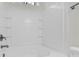 Bathroom featuring a shower and tub combo with tiled walls and wall niche at 1828 Aston Mill Pl, Charlotte, NC 28273