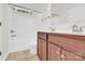 Bathroom featuring a single sink vanity with storage and a shower and tub combo at 1828 Aston Mill Pl, Charlotte, NC 28273
