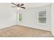 Bedroom featuring carpeted floors, white walls, ceiling fan and sun-filled windows at 1828 Aston Mill Pl, Charlotte, NC 28273