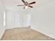 Spacious bedroom features neutral carpeting, ceiling fan, and bright white trim and paint at 1828 Aston Mill Pl, Charlotte, NC 28273
