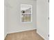 Walk-in closet with single window and white wire shelving offers simple storage at 1828 Aston Mill Pl, Charlotte, NC 28273