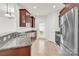Bright kitchen featuring stainless appliances, granite countertops and a door to the outside at 1828 Aston Mill Pl, Charlotte, NC 28273