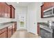 Functional kitchen showcasing modern appliances, granite countertops and plenty of storage at 1828 Aston Mill Pl, Charlotte, NC 28273