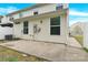 Back of home featuring a concrete patio, vinyl siding, and well-maintained yard space at 1828 Aston Mill Pl, Charlotte, NC 28273