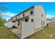 Rear view showcasing the patio and fenced-in yard on a sunny day at 1828 Aston Mill Pl, Charlotte, NC 28273