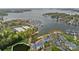 Aerial view of a marina with boats docked on a lake surrounded by condos and trees at 18742 Nautical Dr # 301, Cornelius, NC 28031