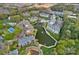 Aerial view showcasing a community with a pool, pond, and well-maintained landscaping at 18742 Nautical Dr # 301, Cornelius, NC 28031