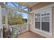 Inviting balcony featuring a wooden deck, chair, and scenic views of the water and surrounding landscape at 18742 Nautical Dr # 301, Cornelius, NC 28031
