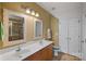 Well-lit bathroom boasts a double sink vanity, neutral decor, and a glass-enclosed shower for a clean aesthetic at 18742 Nautical Dr # 301, Cornelius, NC 28031