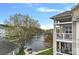 Scenic exterior view from the balcony overlooking a serene lake and a pier for waterfront enjoyment at 18742 Nautical Dr # 301, Cornelius, NC 28031