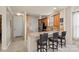 Open kitchen design features a breakfast bar with seating, granite countertops, and stainless steel appliances at 18742 Nautical Dr # 301, Cornelius, NC 28031