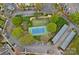 Aerial view of a tennis court surrounded by mature trees and parking areas at 18742 Nautical Dr # 301, Cornelius, NC 28031