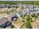 An aerial view captures a fenced backyard, mature trees, and neighborhood amenities including a playground at 190 Silverspring Pl, Mooresville, NC 28117