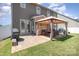 Patio area featuring a gazebo with seating, a grill, and access to the home through french doors at 190 Silverspring Pl, Mooresville, NC 28117