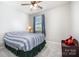 This bedroom features a carpeted floor and ceiling fan at 190 Silverspring Pl, Mooresville, NC 28117
