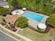 Aerial view showcases the community pool and splashpad, surrounded by lush landscaping and ample seating for residents at 190 Silverspring Pl, Mooresville, NC 28117