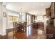 Open dining area with hardwood floors, a view to the kitchen, and lots of windows at 190 Silverspring Pl, Mooresville, NC 28117