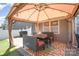 Covered gazebo on a paver patio with outdoor dining set and string lights, perfect for relaxing and entertaining at 190 Silverspring Pl, Mooresville, NC 28117