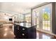 Kitchen and dining area features hardwood floors, an island, and glass doors to the outside at 190 Silverspring Pl, Mooresville, NC 28117