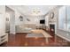 Spacious living room with hardwood floors, fireplace, and a comfortable sectional sofa at 190 Silverspring Pl, Mooresville, NC 28117