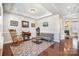 Comfortable living room area with a futon, rocker and access to other spaces at 190 Silverspring Pl, Mooresville, NC 28117