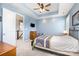 This main bedroom offers a trey ceiling with fan, and opens to ensuite bathroom and walk-in closet at 190 Silverspring Pl, Mooresville, NC 28117