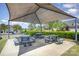 Community picnic area features multiple tables under a shaded canopy, providing a comfortable outdoor space for gatherings at 190 Silverspring Pl, Mooresville, NC 28117