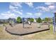 Community playground with swings, slides, and climbing structures, designed for recreation and play at 190 Silverspring Pl, Mooresville, NC 28117