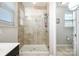 This tile shower features glass doors and dual shower heads at 190 Silverspring Pl, Mooresville, NC 28117
