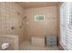 Bathroom features a walk-in shower, tile surround, and neutral colors at 203 Mt Holly Huntersville Rd, Huntersville, NC 28078