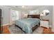 Bedroom with hardwood floors, plantation shutters, and stylish decor at 203 Mt Holly Huntersville Rd, Huntersville, NC 28078