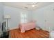 A room with a twin bed and window at 203 Mt Holly Huntersville Rd, Huntersville, NC 28078