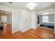 A bedroom with a built-in closet and a view of the bed at 203 Mt Holly Huntersville Rd, Huntersville, NC 28078