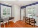 A bedroom with a desk, chair, and large framed mirror at 203 Mt Holly Huntersville Rd, Huntersville, NC 28078