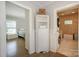 Hallway between bedroom and bathroom with cabinet for storage at 203 Mt Holly Huntersville Rd, Huntersville, NC 28078