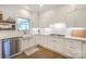 Well-lit kitchen with white cabinetry, stainless steel appliances, and subway tile backsplash at 203 Mt Holly Huntersville Rd, Huntersville, NC 28078