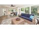 Bright sun room with tile floors, windows overlooking a lush backyard, and neutral decor at 203 Mt Holly Huntersville Rd, Huntersville, NC 28078
