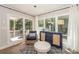 Inviting sun room with backyard views, comfortable seating, and stylish decor at 203 Mt Holly Huntersville Rd, Huntersville, NC 28078