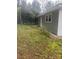 The spacious backyard provides outdoor recreation and gardening at 211 W 2Nd St, Kershaw, SC 29067