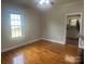 Cozy bedroom with hardwood floors and an open doorway to another room at 211 W 2Nd St, Kershaw, SC 29067