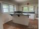 Well-lit kitchen featuring an island and ample cabinet space at 211 W 2Nd St, Kershaw, SC 29067