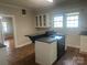 Kitchen with island cooktop and ample natural light at 211 W 2Nd St, Kershaw, SC 29067