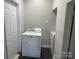 Laundry room equipped with a modern washer and dryer at 211 W 2Nd St, Kershaw, SC 29067
